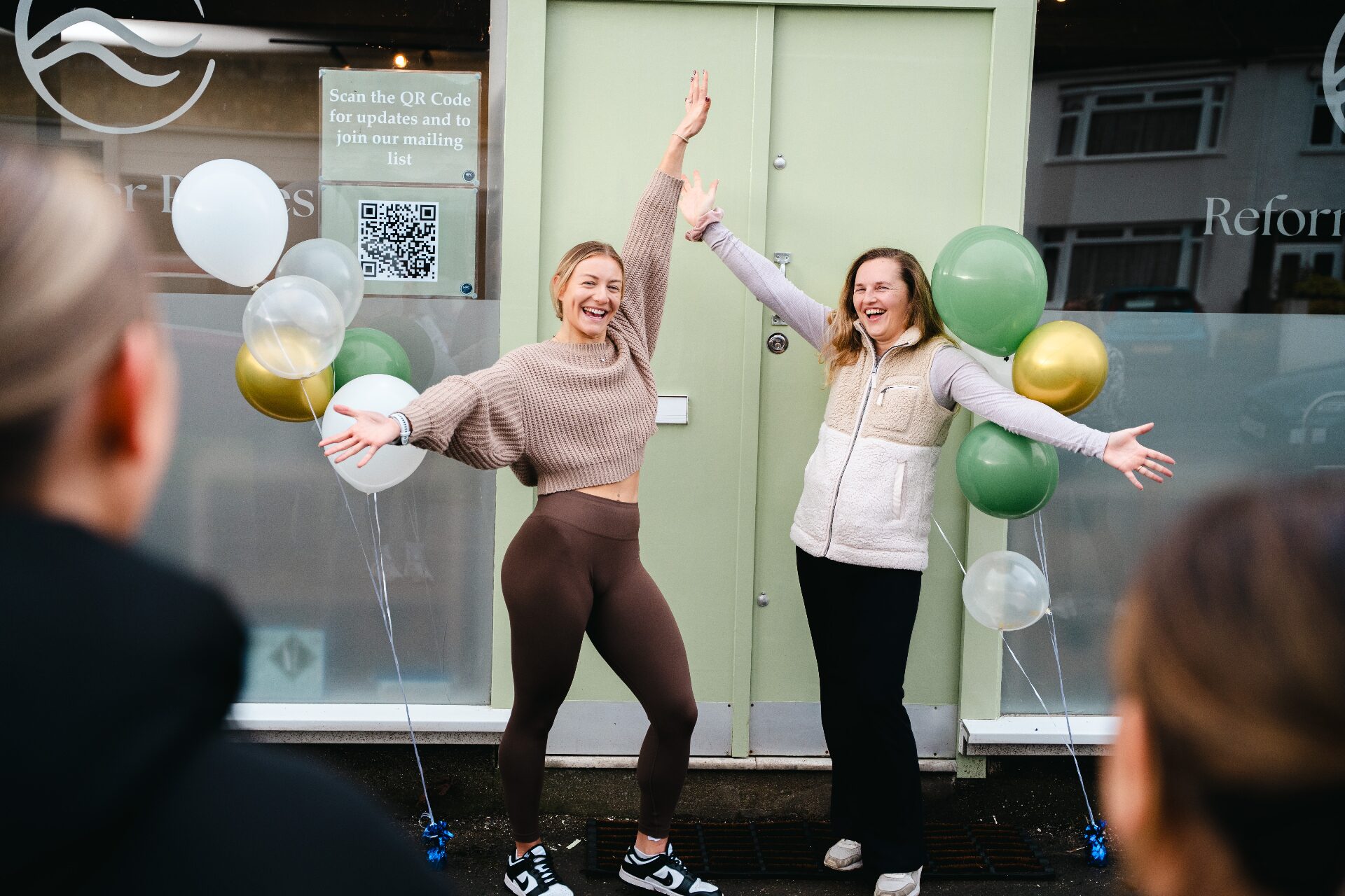 Bristol Pilates studio launch — team celebrating with balloons outside the new Henleaze studio