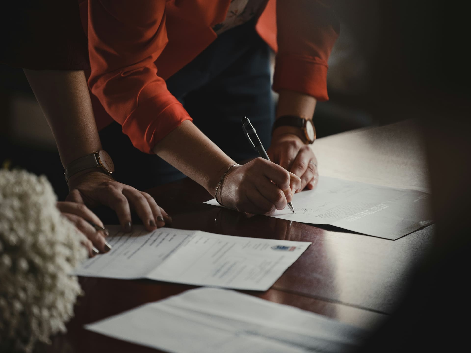 Solicitor signing legal documents at a desk — social media agency for law firms and legal professionals