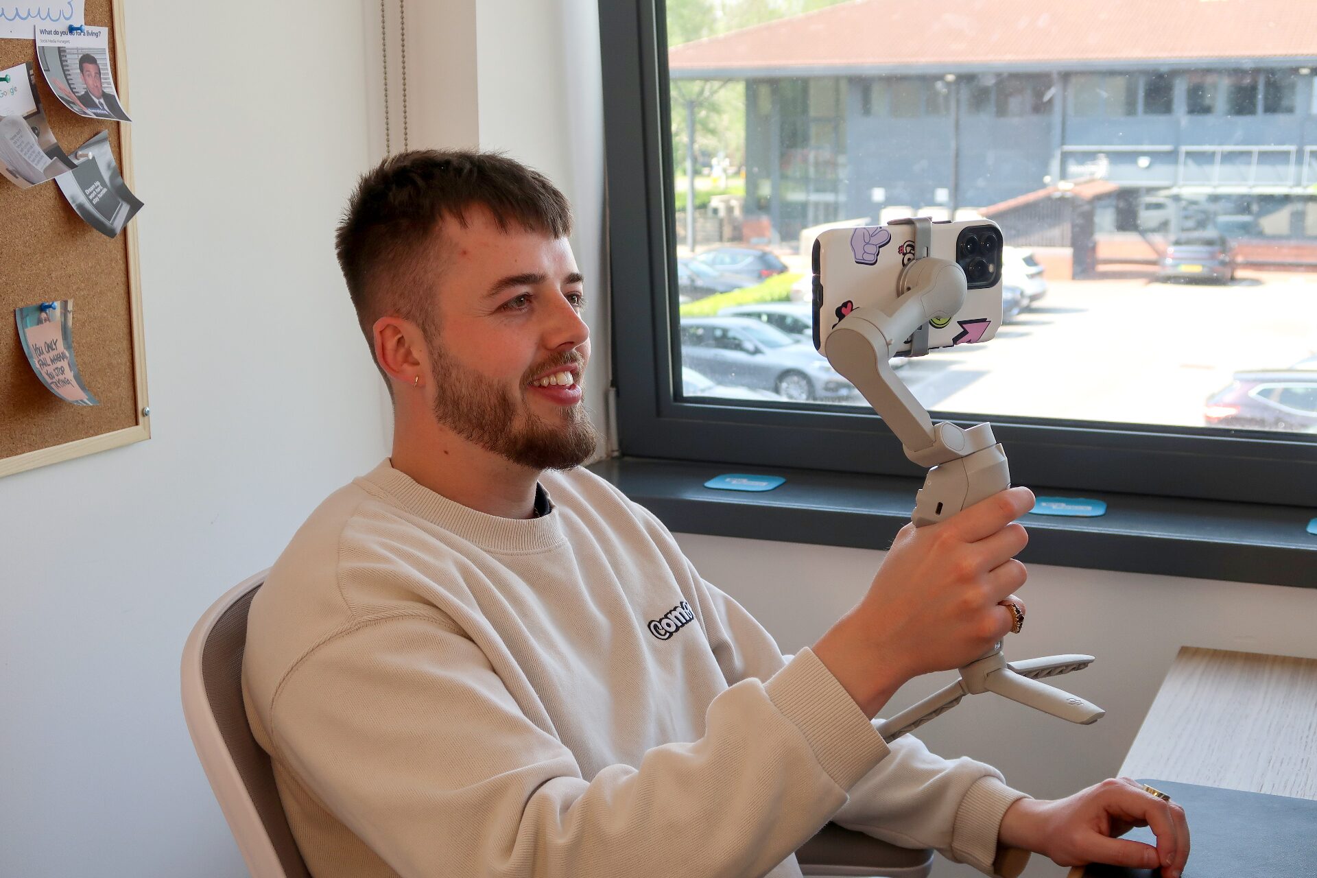 Compelite Pro team member filming content on a gimbal in the Bristol office